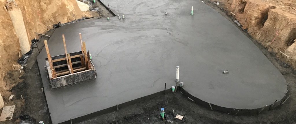 Fresh concrete slab poured on site