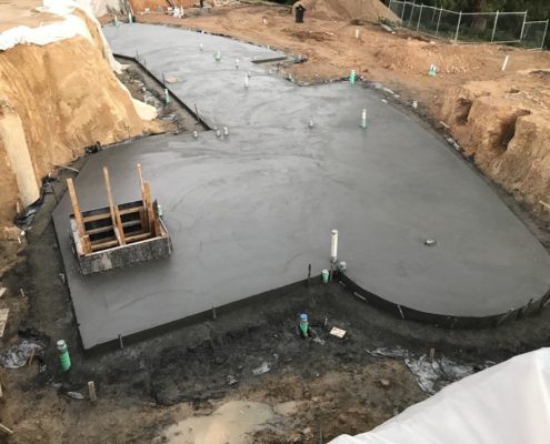 Fresh concrete slab poured on site