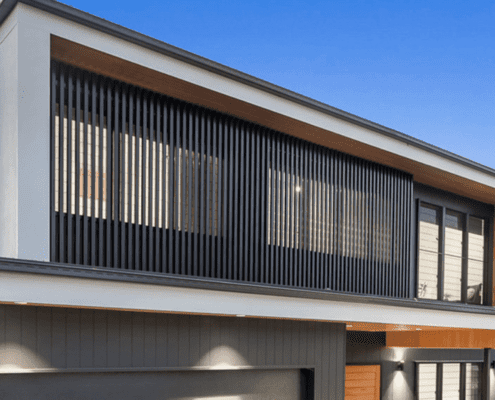 Luxe Metalworks privacy screens on modern two story house