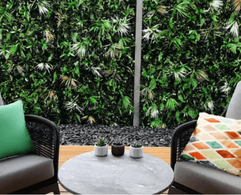 Lounge chair suite against a green garden wall backdrop