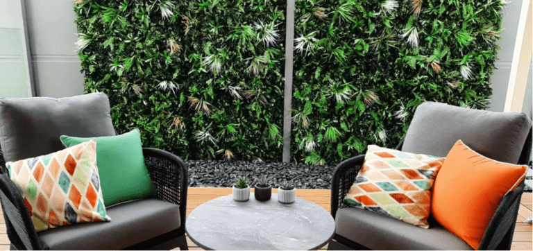 Lounge chair suite against a green garden wall backdrop