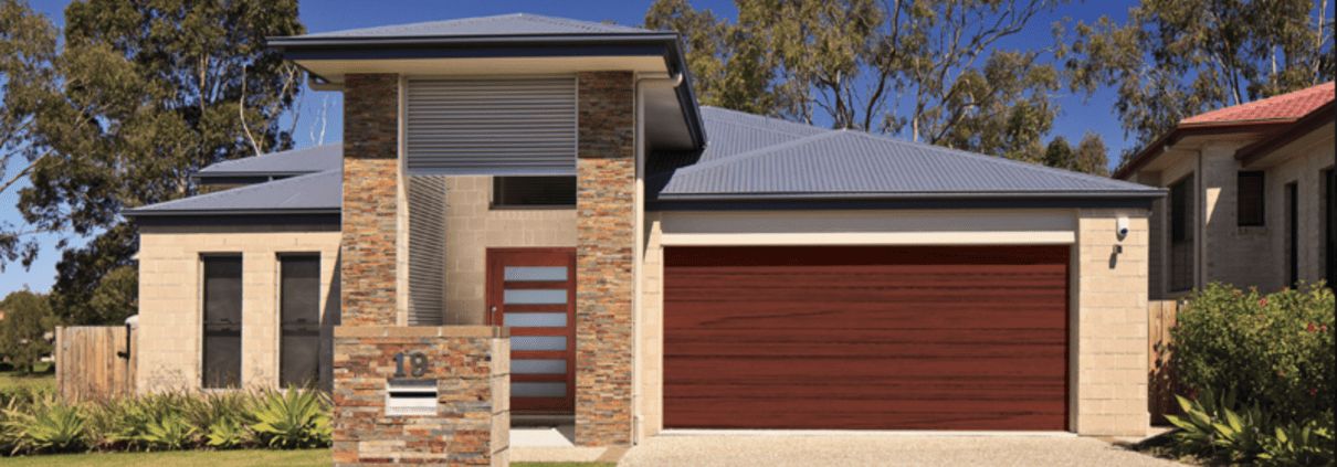 Residential house with dark timber look garage door