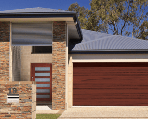 Residential house with dark timber look garage door