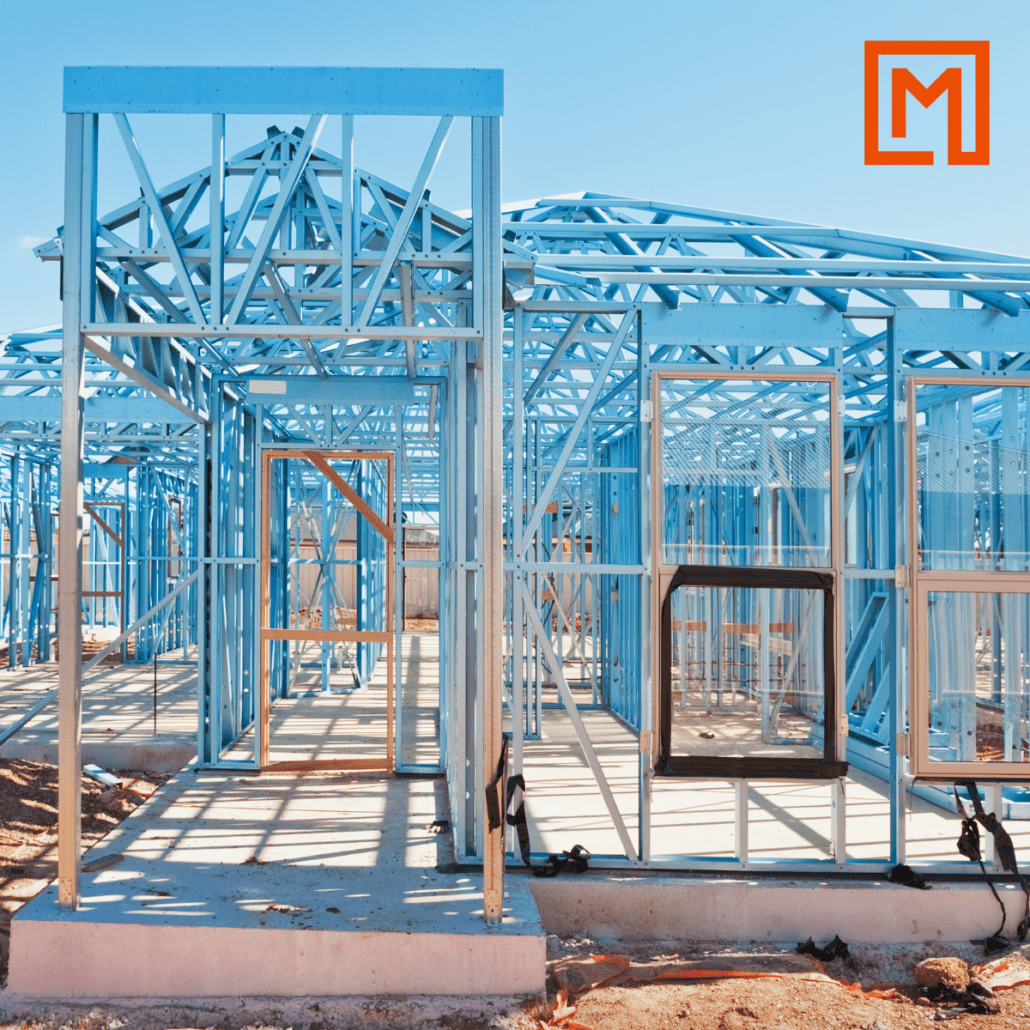 Metframe Australia steel framing and trusses with windows installed. Orange Metframe Australia logo in the top right corner.