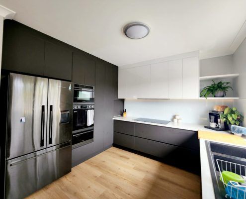 Black fridge and black cabinetry