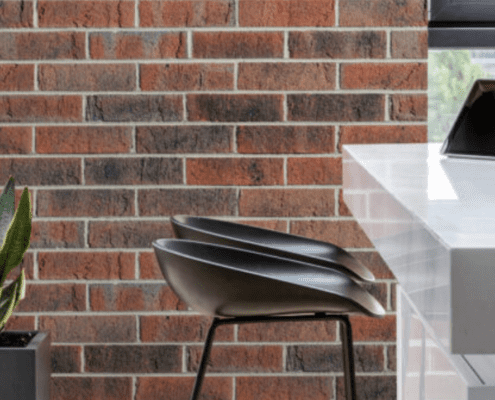 Exterior outdoor setting against a red brick wall