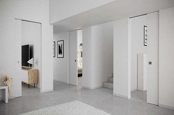 White interior walls in living room with three bedrooms with half closed timber sliding doors