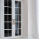 White timber French doors with gold handles