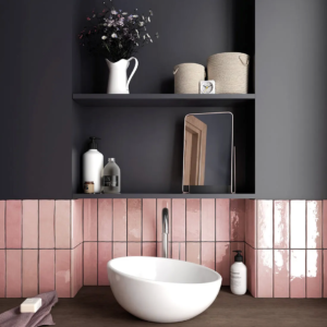 Bathroom vanity with pink rectangle splash back and black painted wall