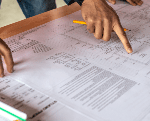 Wunderbuild estimating feature image fingersz pointing to paper