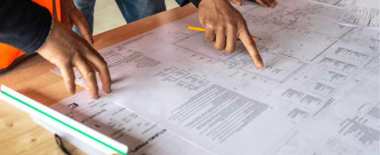 Wunderbuild estimating feature image fingersz pointing to paper