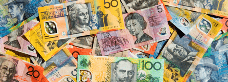 Colourful Australian money spread out in a messy pile