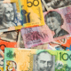 Colourful Australian money spread out in a messy pile