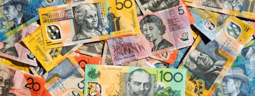 Colourful Australian money spread out in a messy pile