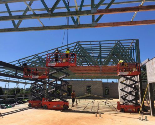 Versace Timbers installation workers and machinery on site