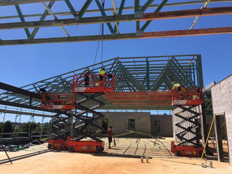 Versace Timbers installation workers and machinery on site