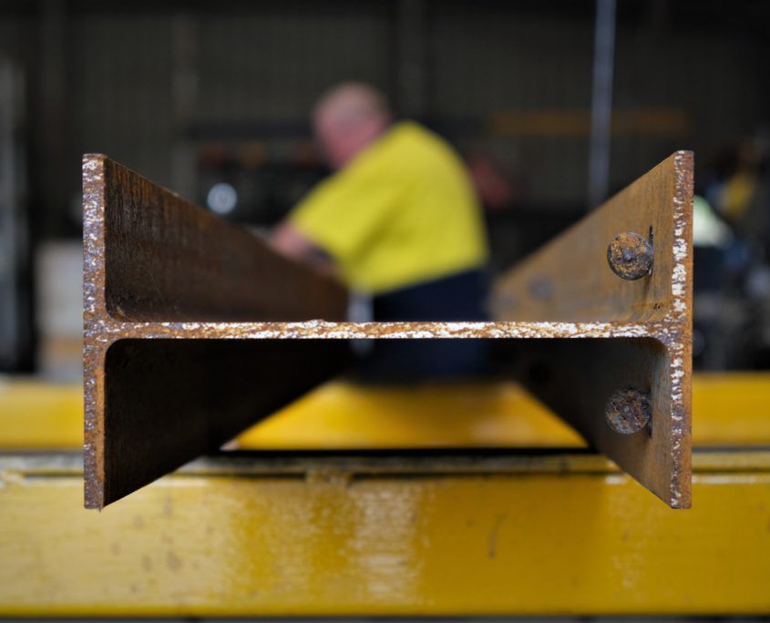 Employee welding Brisbane Posts and Beams