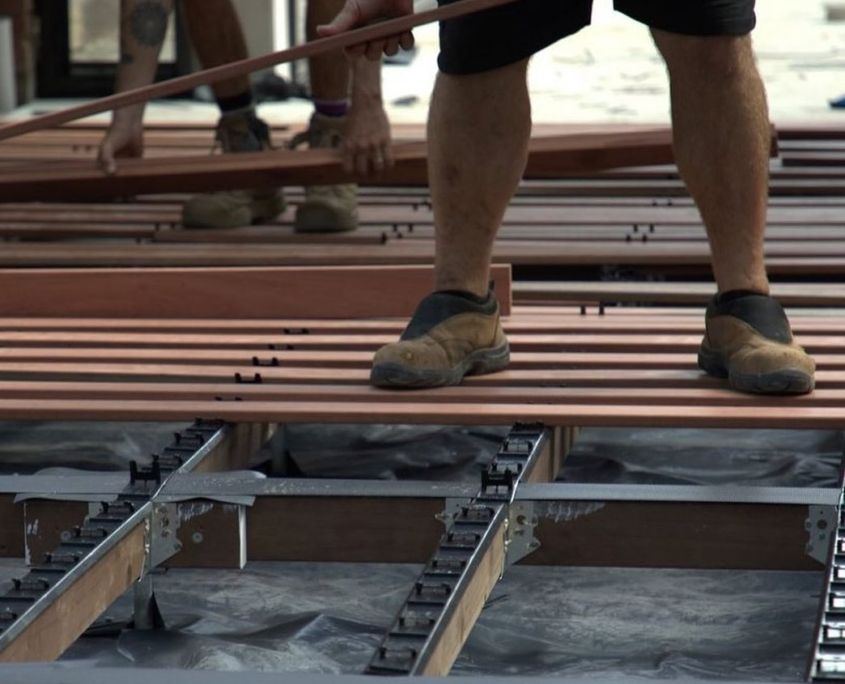 employee laying decking