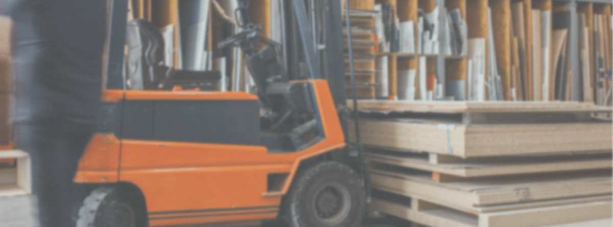 broad traders australia banner forklift in warehouse picking up stack of boards