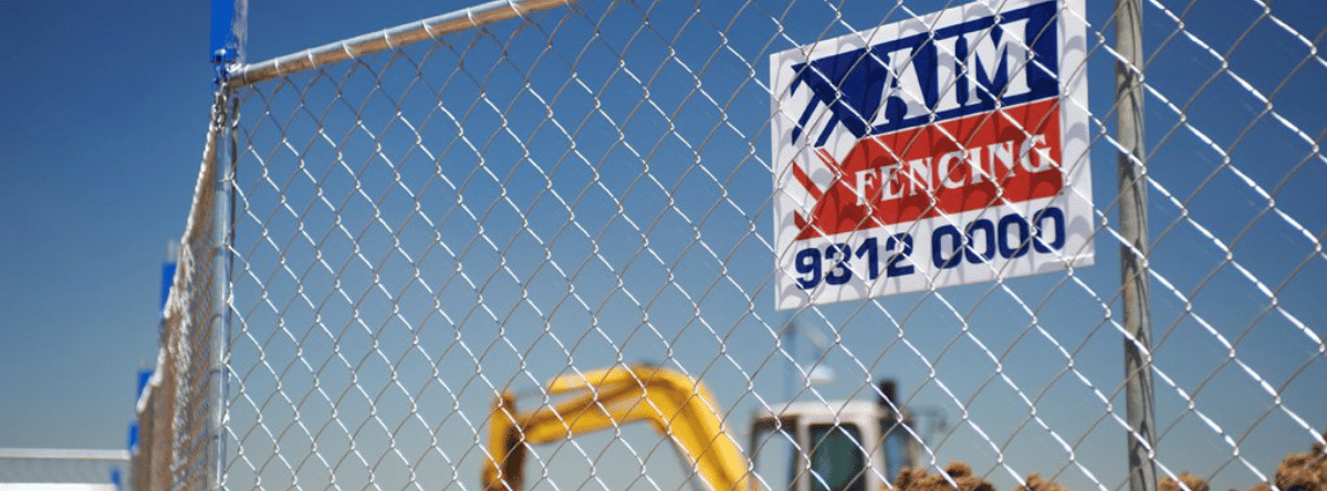 Aim Hire fencing with construction site behind it