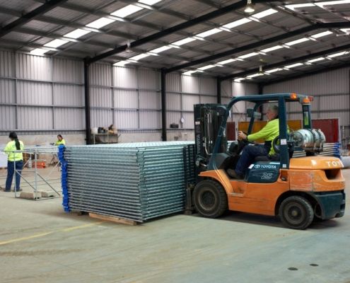 aim hire fencing warehouse forklift with fence order