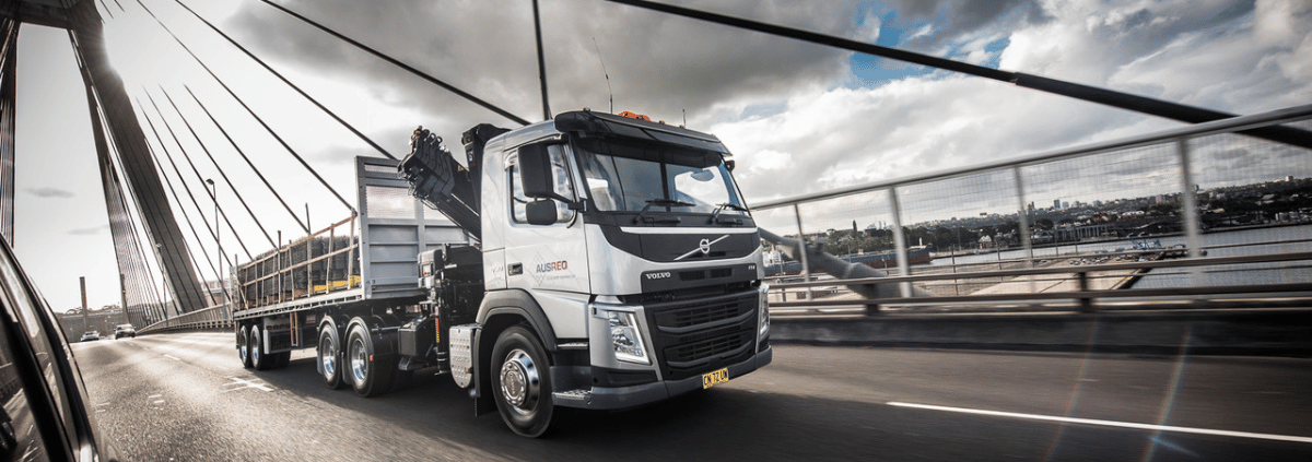 Newsletter Banner 2025 ausreo truck delivering reo over steel bridge