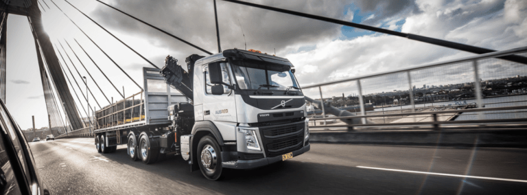 Newsletter Banner 2025 ausreo truck delivering reo over steel bridge