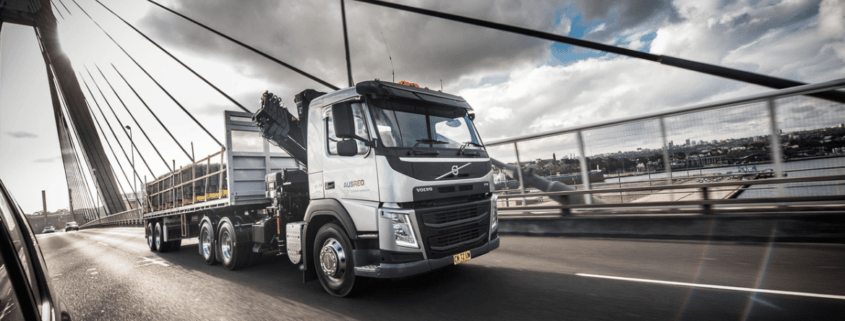 Newsletter Banner 2025 ausreo truck delivering reo over steel bridge