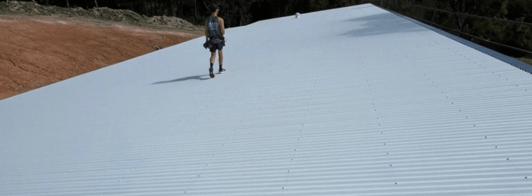 Newsletter Banner BJ roofing metal roofing with employee walking along